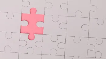 Pink puzzle piece fitting in – representing how EMDR therapy may be the missing piece in healing near Farmington Hills MI