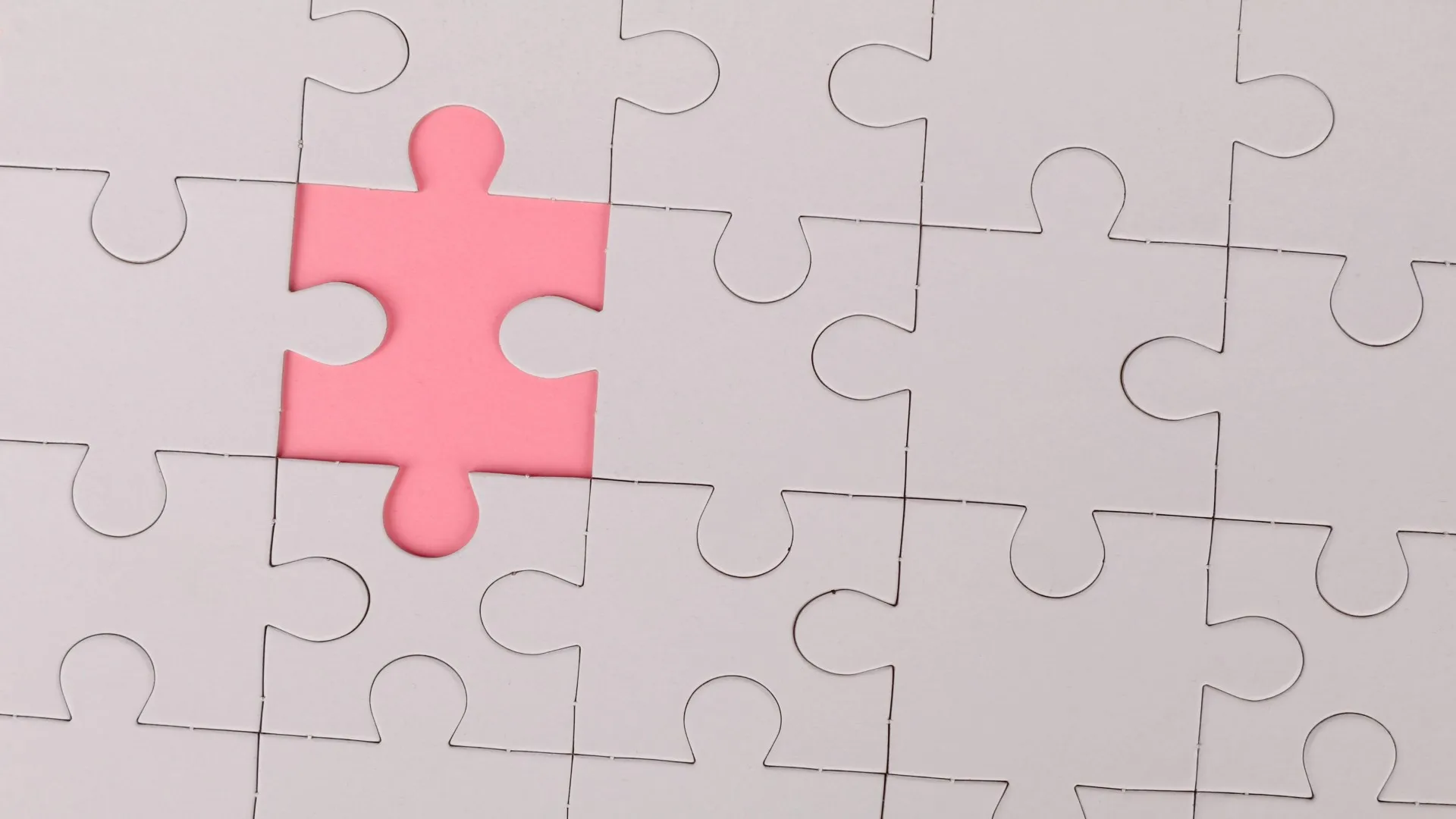 Pink puzzle piece fitting in – representing how EMDR therapy may be the missing piece in healing near Farmington Hills MI