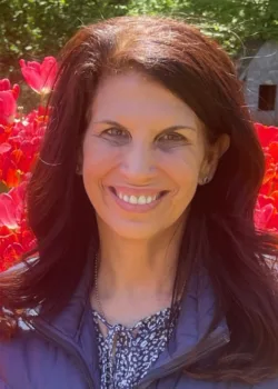 Andrea Nitzkin, EMDR Therapist at Bright Spot Counseling, smiling outdoors