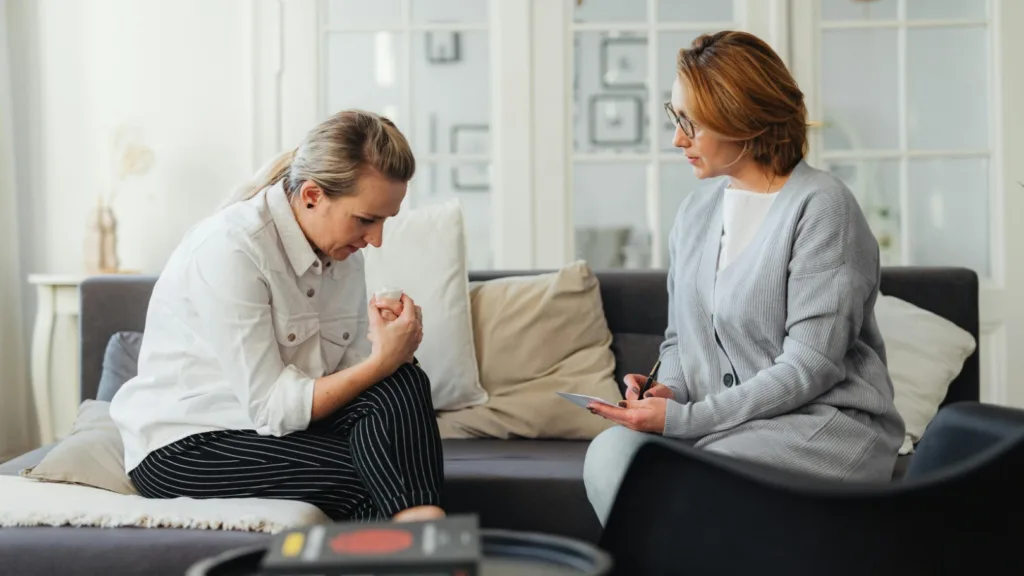 Therapist and client engaged in a deep conversation during a counseling session, symbolizing emotional exploration and healing.
