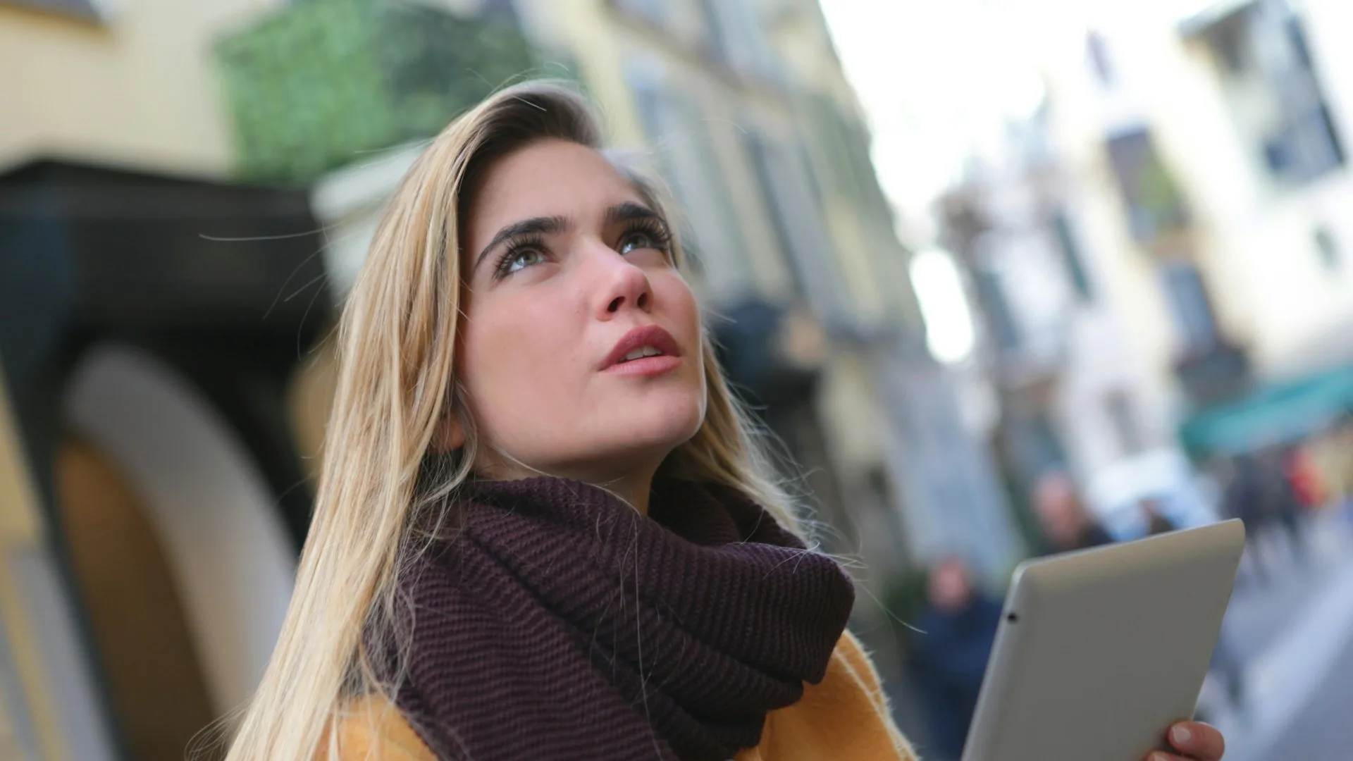 Young woman searching online for a mental health therapist in Farmington Hills Michigan