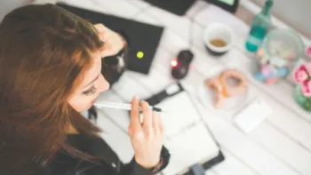 Woman journaling during therapy – exploring effective mental health treatments in Farmington Hills Michigan