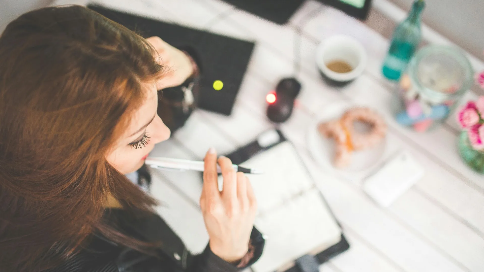 Woman journaling during therapy – exploring effective mental health treatments in Farmington Hills Michigan